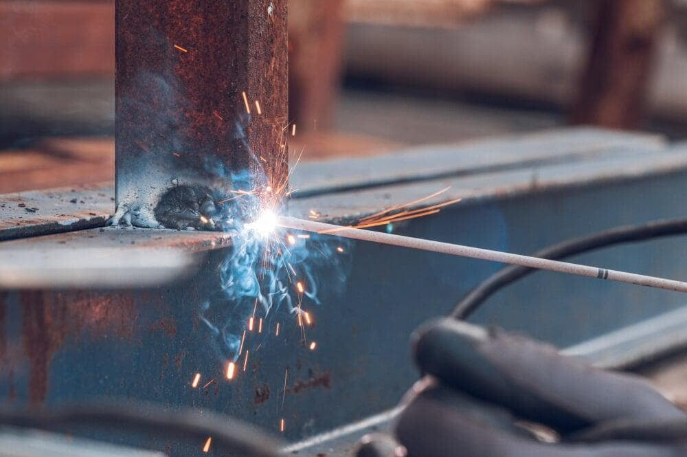 Welder working on a steel component