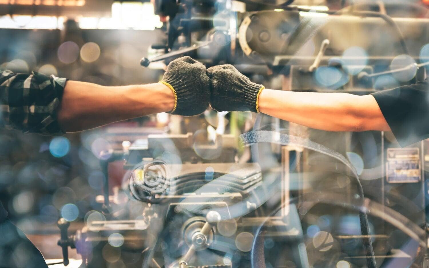 Technician’s hands working on industrial machinery